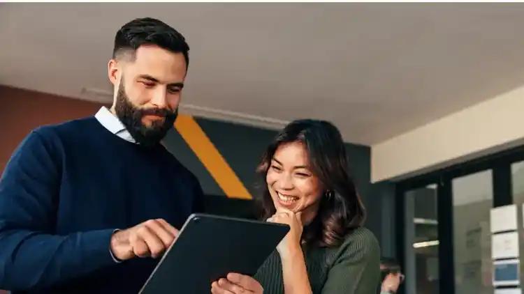 Man and Woman looking at Report