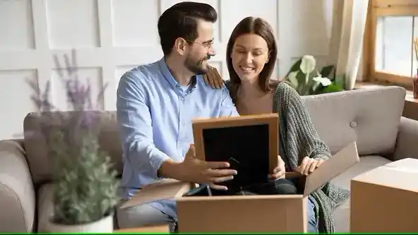 Couple in home looking at Picture